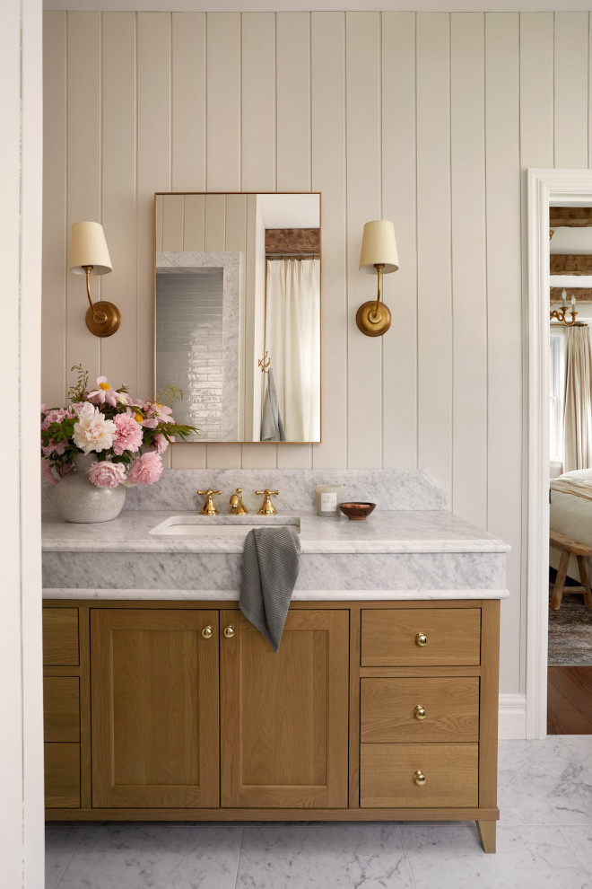 Close-up of Benjamin Moore Seapearl creamy white paint in French country bathroom with natural light and warm accents.