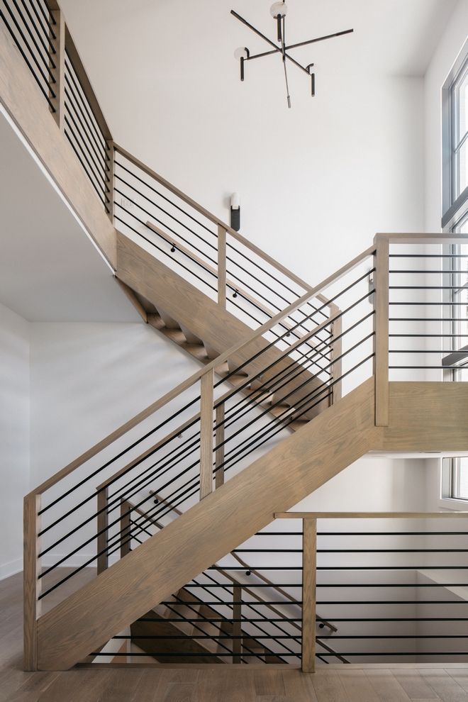 This staircase perfectly captures the organic modern style with its warm White Oak treads open risers and sleek black metal railings The natural wood finish adds softness #WhiteOakStairs #WoodStainFinish #BlackMetalRailings #OrganicModernStyle #ModernOrganicHome #ModernStaircase This staircase perfectly captures the organic modern style with its warm White Oak treads open risers and sleek black metal railings The natural wood finish adds softness #WhiteOakStairs #WoodStainFinish #BlackMetalRailings #OrganicModernStyle #ModernOrganicHome #ModernStaircase