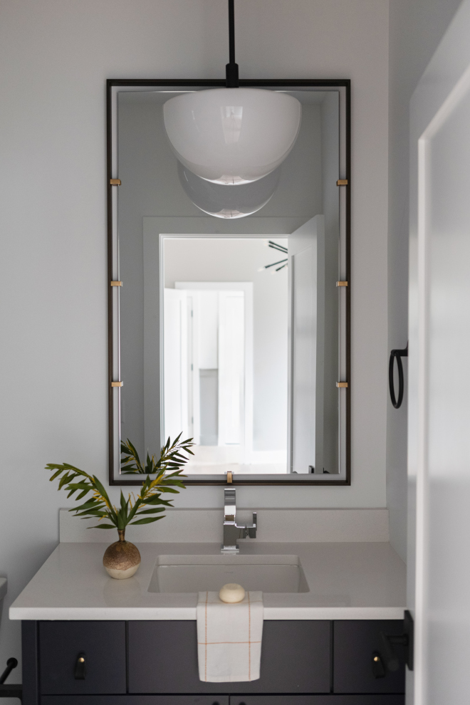 Bathroom paint color inspiration featuring Sherwin Williams Cyberspace cabinetry paired with Chantilly Lace walls.