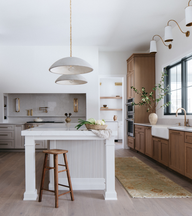 2026-new-home-kitchen-ribbed-island-gossamer-veil Ribbed kitchen island in Sherwin Williams Gossamer Veil with textured detailing in a 2026 new construction home.