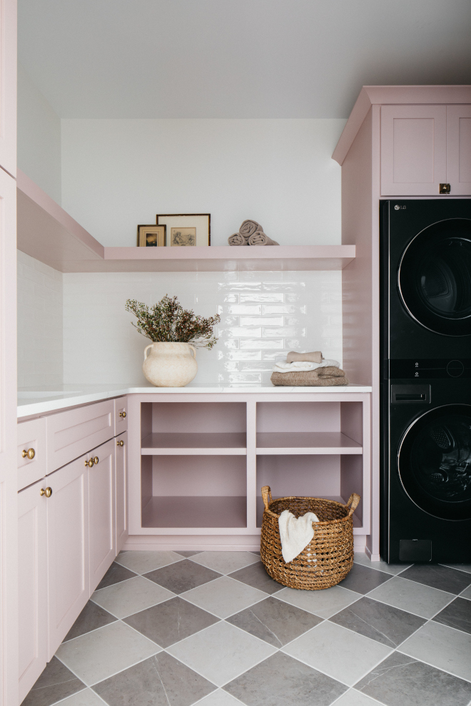 2026-new-home-laundry-room-insightful-rose-cabinets-vanilla-milkshake Laundry room with blush pink cabinets in Sherwin Williams Insightful Rose, checkered floor tiles, and Benjamin Moore Vanilla Milkshake walls in a 2026 new construction home.