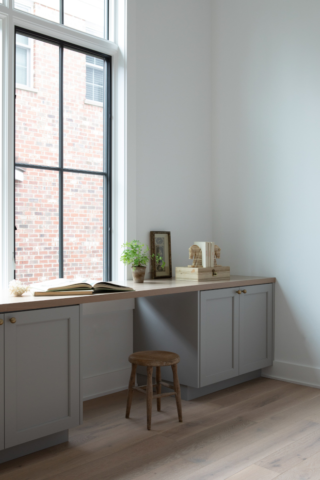 Close-up of warm gray cabinet paint color Sherwin Williams Warm Pewter used in a family command center.