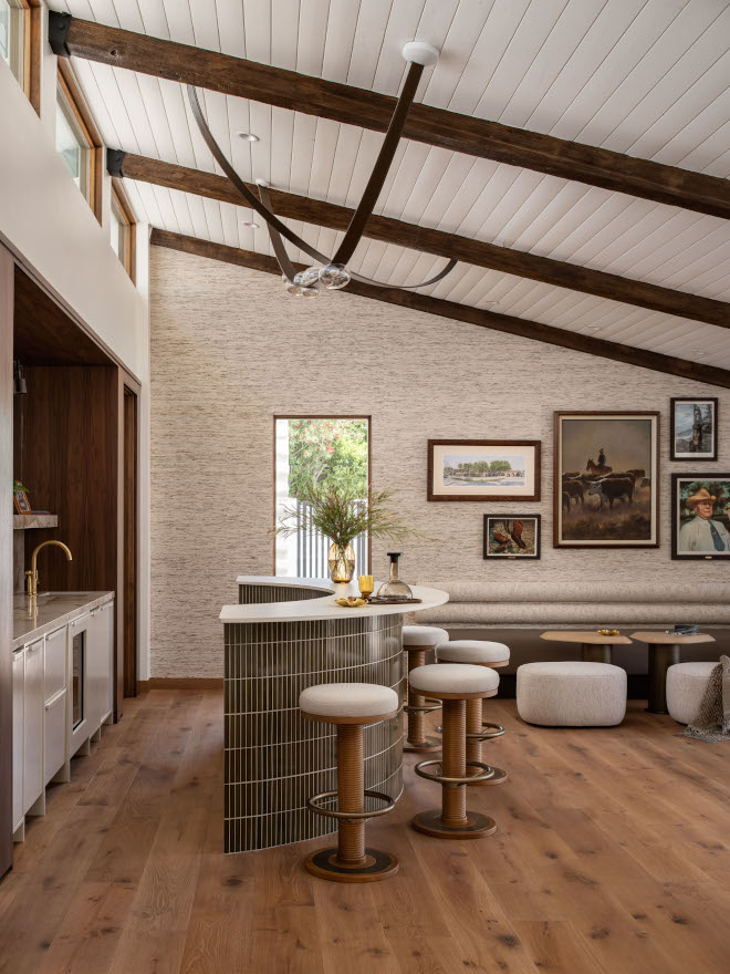 Custom bar cabinetry with high-gloss lacquer in Sherwin Williams Natural Linen walls for a warm mid-century modern feel.