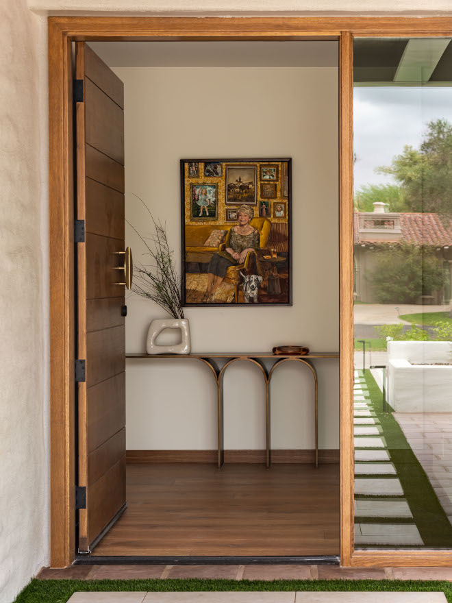 Arizona mid-century modern home front door with warm wood tones, clean modern design, and inviting entryway, surrounded by desert landscaping