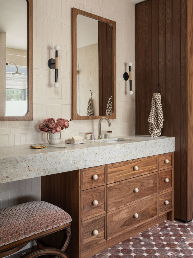 Bathroom vanity showing thick mitered countertop and backsplash with 2"x8" ivory matte ceramic tiles in a vertical Crosshatch pattern, paired with warm walnut cabinetry and integrated pulls for a mid-century modern feel.