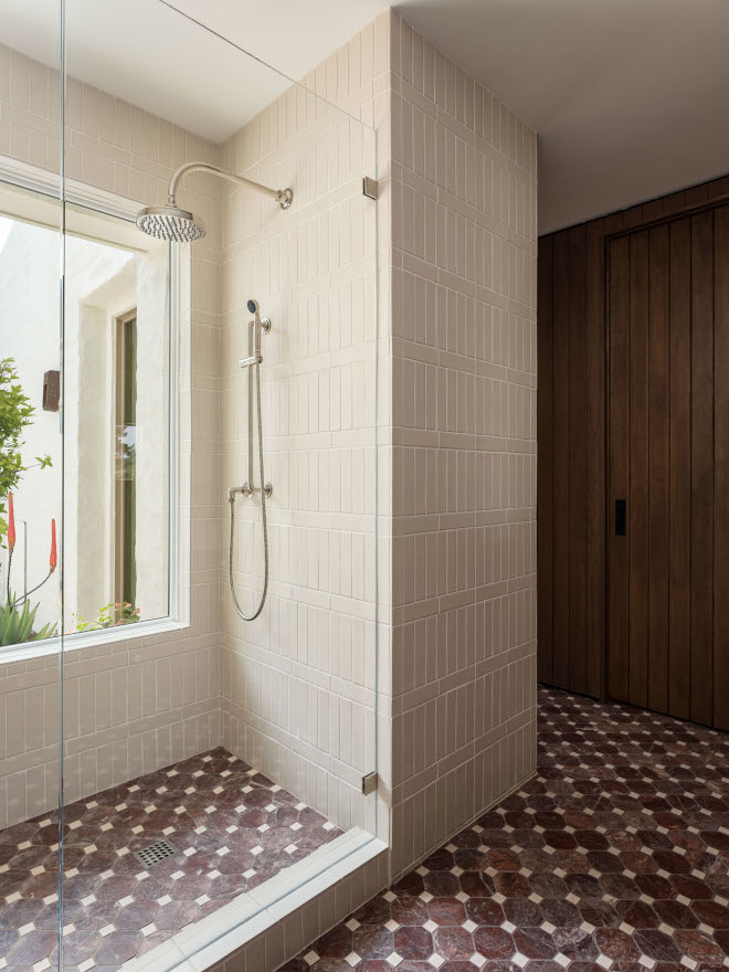 Mid-century modern bathroom shower with 2"x8" ivory matte ceramic tiles arranged in a vertical Crosshatch pattern, wrapping the walls for a cohesive, textured look and paired with a large window bringing in natural light.