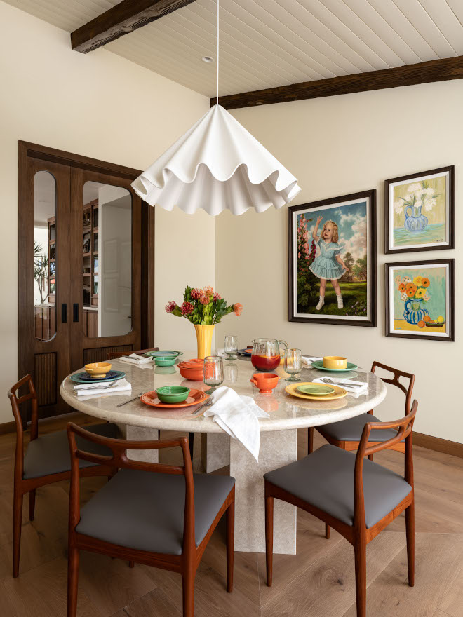 Large-scale recycled polyester felt chandelier resembling a twirling skirt, adding warmth and playfulness to mid-century modern dining room.