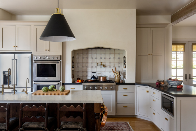 Kitchen painted in Benjamin Moore Bone, a soft neutral warm white, highlighting French Country design with cozy layered textures, wood accents, and timeless elegance.