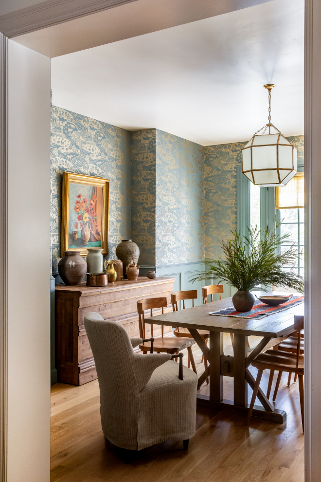 Interior wall painted in Farrow and Ball De Nimes, a deep muted blue, adding French Country elegance and depth to a living space with classic architectural details