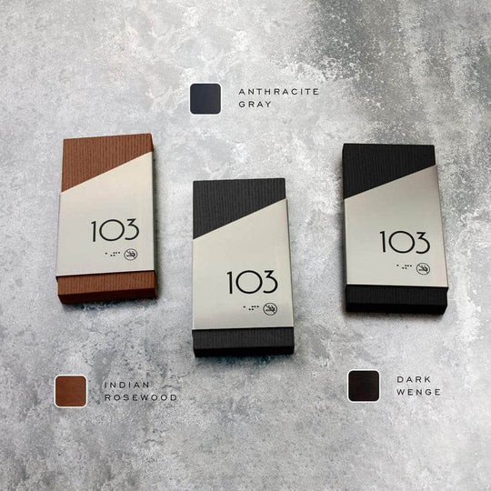 Organic modern apartment entrance featuring a wood‑tone number sign against textured wall