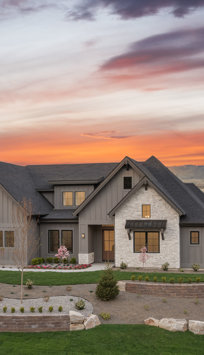 Idaho new construction home with Sherwin Williams Gauntlet Gray siding paired with Rocky Mountain stone exterior
