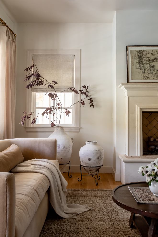 Swiss Coffee walls with darker trim providing warmth and depth to a French Country mountain living space