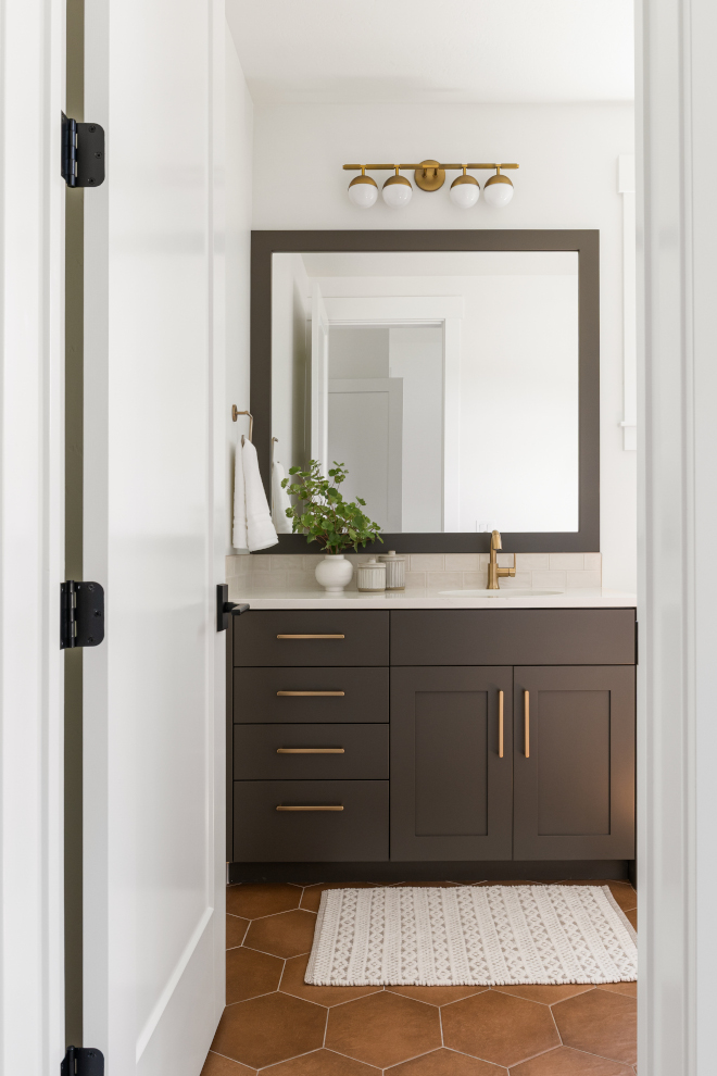 Guest bathroom with Sherwin Williams Urbane Bronze cabinets and neutral accents