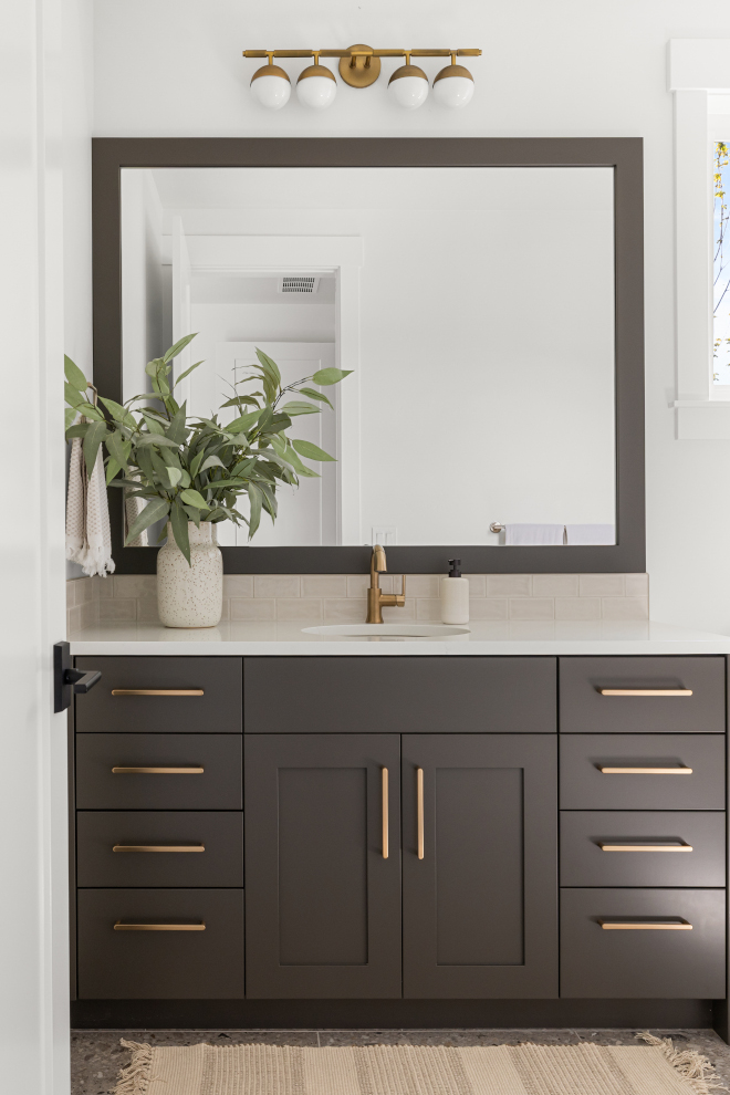 Guest bathroom with Sherwin Williams Urbane Bronze cabinets and neutral accents