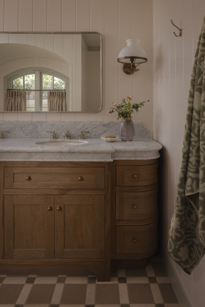 custom oak vanity with matte stain finish in primary bathroom