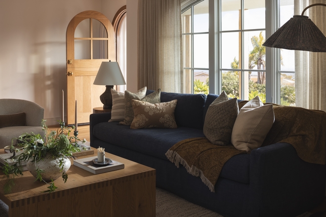 California living room with linen slipcovered sofa linen draperies large windows