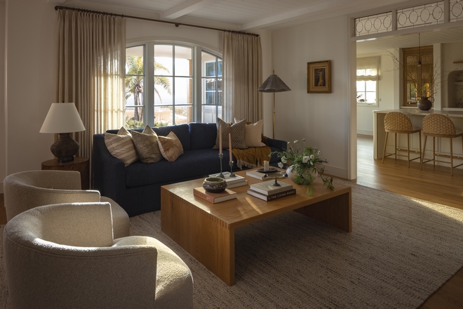 The walls are painted in Benjamin Moore OC-17 White Dove, one of the most beloved warm white paint colors among designers. Instead of feeling stark, this shade adds a soft warmth that works beautifully with linen textures, natural wood, and layered neutral decor