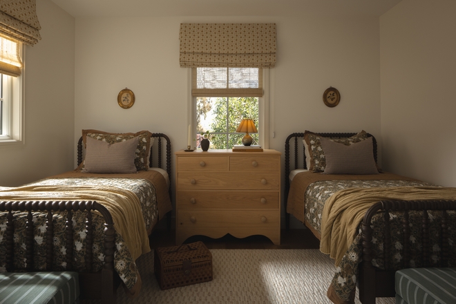 shared bedroom with spindle beds and Benjamin Moore White Dove walls