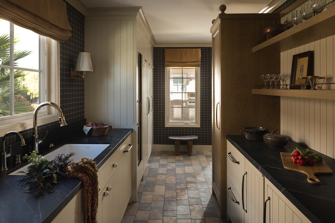 scullery kitchen with layered finishes classic cabinetry and warm neutral design details