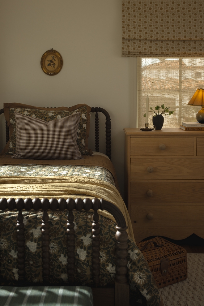 Guest bedroom with spindle bed neutral color scheme neutral bedroom antique looking dresser