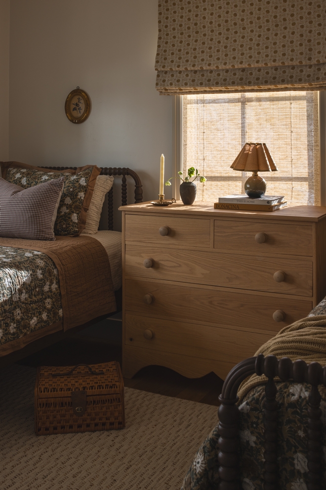 light wood dresser with scalloped base and rounded knobs