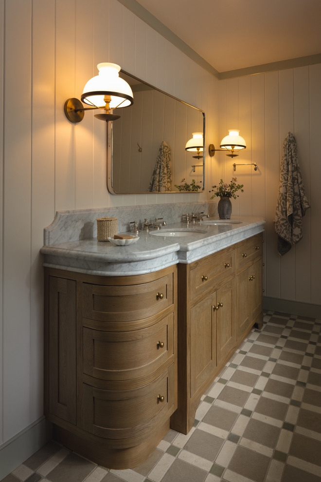 primary bathroom with custom curved oak vanity and Carrara marble countertop