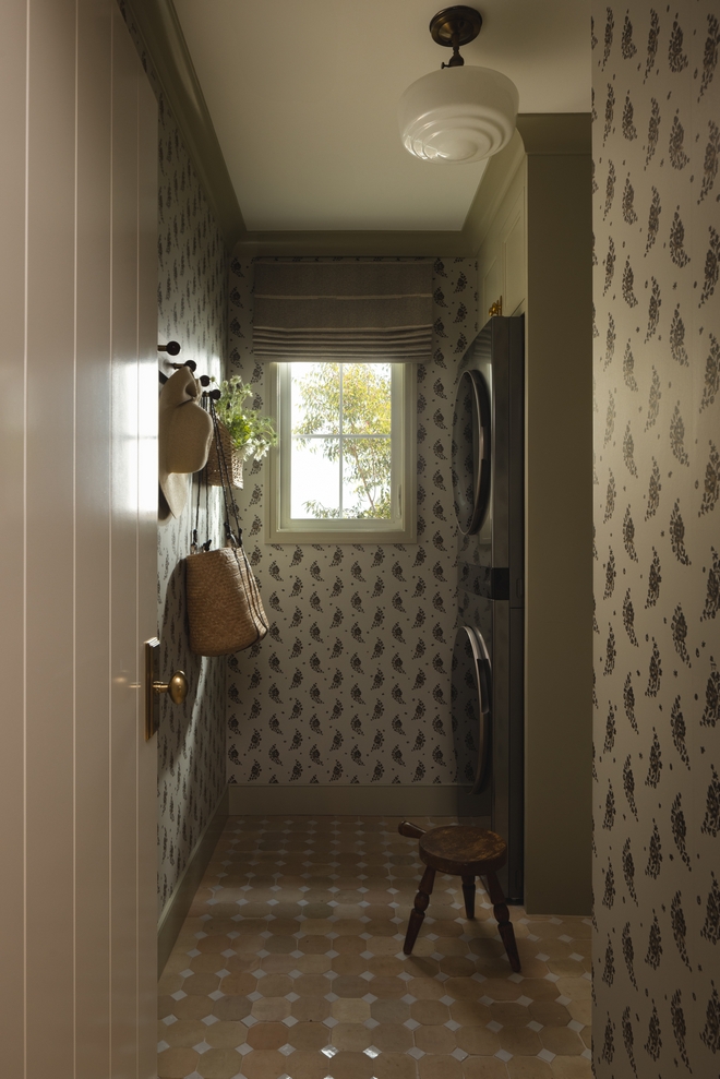 laundry room with zellige octodot tile wallpaper and cabinets painted Farrow and Ball Ball Green
