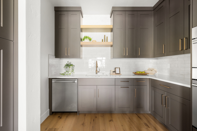 Butler’s pantry with Sherwin Williams Urbane Bronze cabinets, sink, and wall ovens