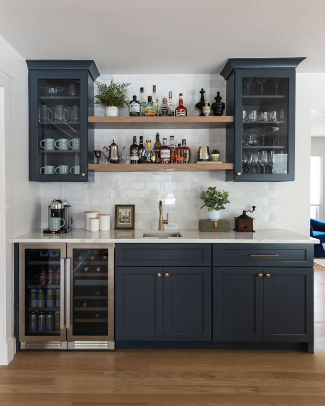 wet-bar-with-navy-cabinetry-painted-Benjamin-Moore-Westcott-Navy Fully equipped wet bar with navy cabinetry painted Benjamin Moore Westcott Navy, quartz countertop, and Minwax Weathered Oak stained details in kitchen remodel