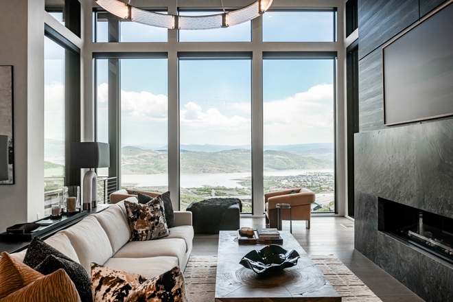 modern living room fireplace with panoramic mountain and lake views