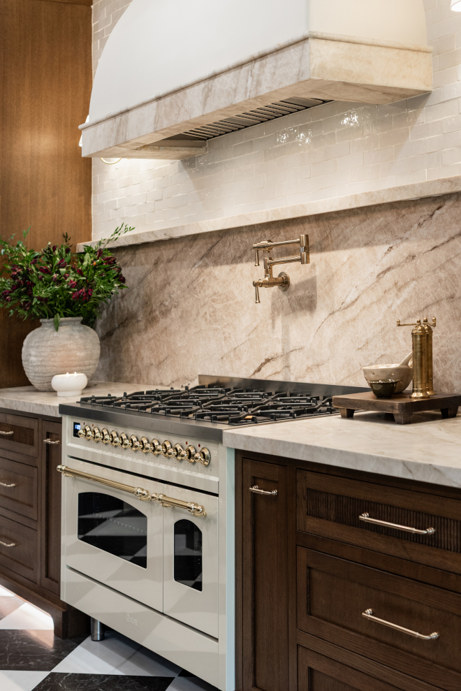perimeter-countertop-taj-mahal-quartzite-leathered Leathered Taj Mahal Quartzite perimeter countertop with a 1.5-inch mitered edge in a luxury kitchen featuring walnut stained white oak cabinetry.