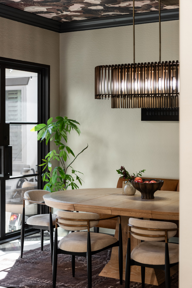 sherwin-williams-creamy-dining-room Dining room painted Sherwin-Williams Creamy with warm neutral walls and black architectural accents.