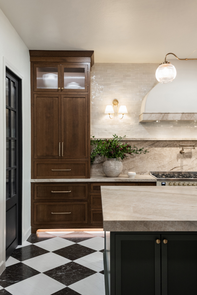 sherwin-williams-creamy-kitchen-paint-color Kitchen featuring Sherwin-Williams Creamy walls and ceiling with walnut stained cabinetry and Taj Mahal Quartzite.