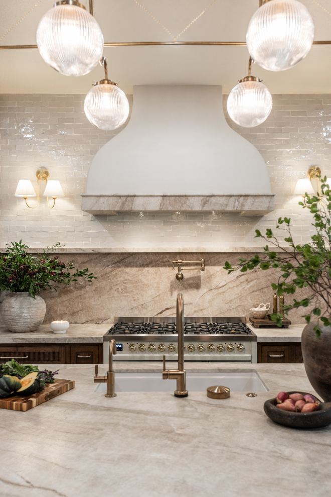 taj-mahal-quartzite-slab-backsplash Leathered Taj Mahal Quartzite slab backsplash and custom hood trim.