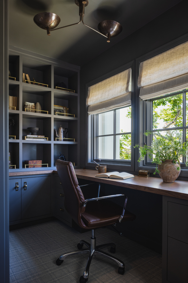 Moody-English-Country-Home-Office Moody Modern English Country home office with deep charcoal cabinetry, walnut desk, linen Roman shades and cognac leather chair.