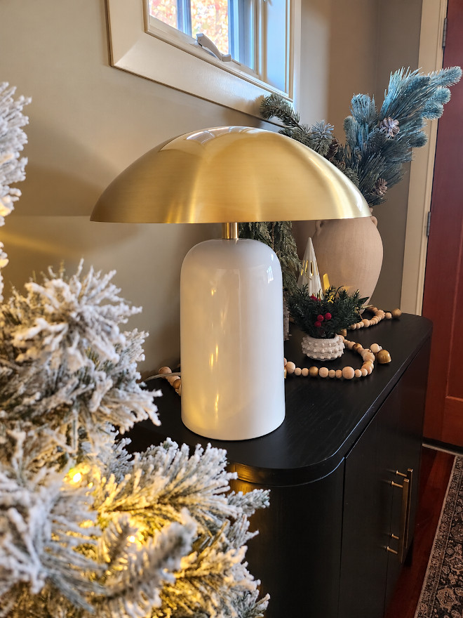 Holiday foyer cabinet decorating ideas Foyer with two-door cabinet displaying festive holiday decor