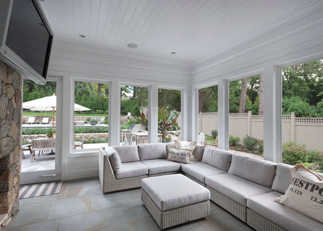 Screened porch with fieldstone fireplace, a granite patio with outdoor barbeque kitchen, spectacular landscaping and fieldstone walls with multiple areas of landscape lighting for dramatic effect at night, a gunite pool with waterfall spa and a custom water fountain and hammock, both attached and resting from hand carved reclaimed municipal building steps. Blue Water Home Builders.