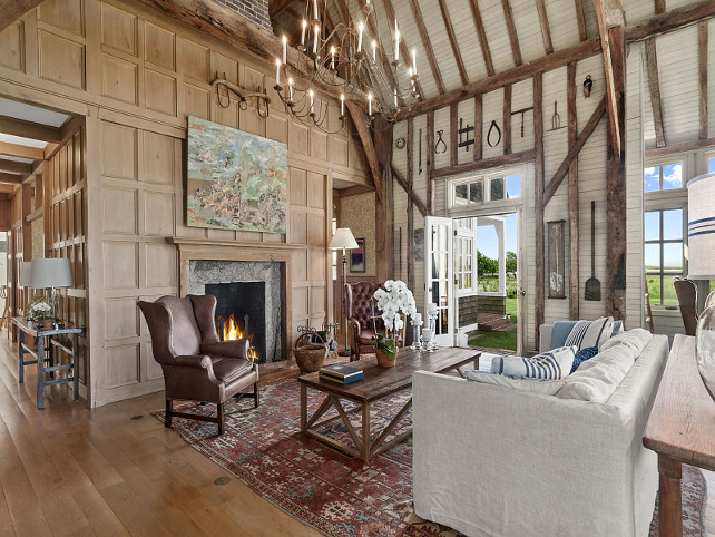 Beach house living room with rustic decor, paneled walls, plank walls, vault ceiling with trussels. #LivingRoom #CoastalLivingRoom #RusticLivingRoom #PlankWallLivingRoom #ChandelierLivingRoom #VaultCeiling #TrusselCeiling