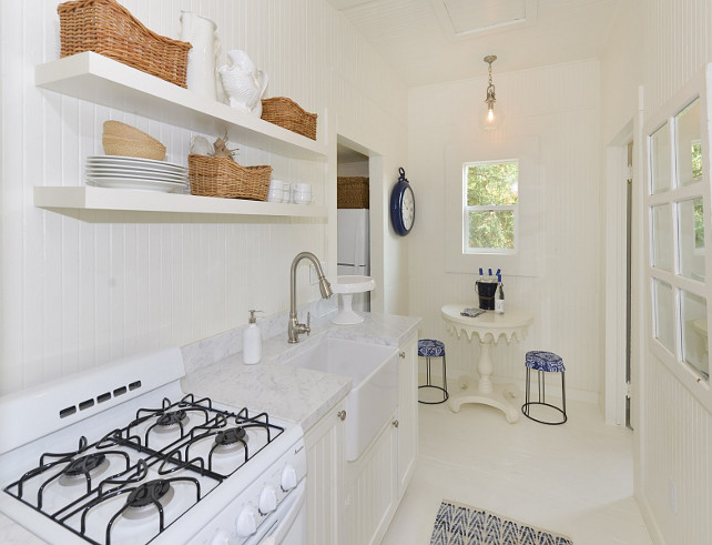 Small White Kitchen. Small All white Cottage kitchen. Small all white kitchen. Small white kitchen with white cabinets, white open shelves, white painted floors and white stove. #Allwhitekitchen #whitekitchen #Smallwhitekitchen #SmallKitchen #CottageKitchen