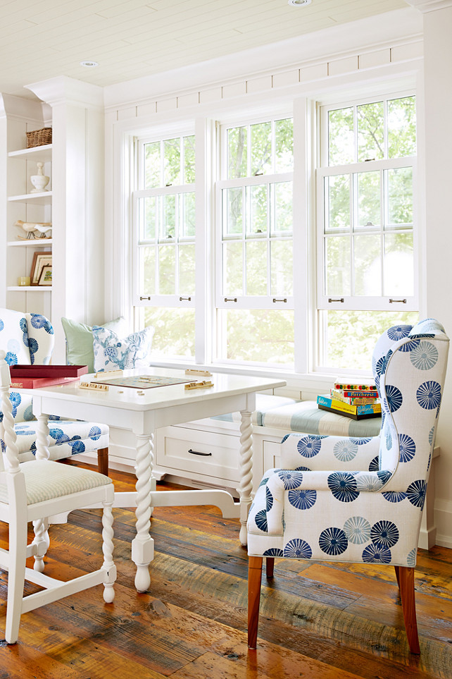 Breakfast Room Banquette and Chairs designed by Sarah Richardson. Breakfast room. Classic wingback chairs get an upgrade with a fresh print from Lee Jofa. Paired with a white game table, they make the house's library a cozy gathering spot. Designed by Sarah Richardson.