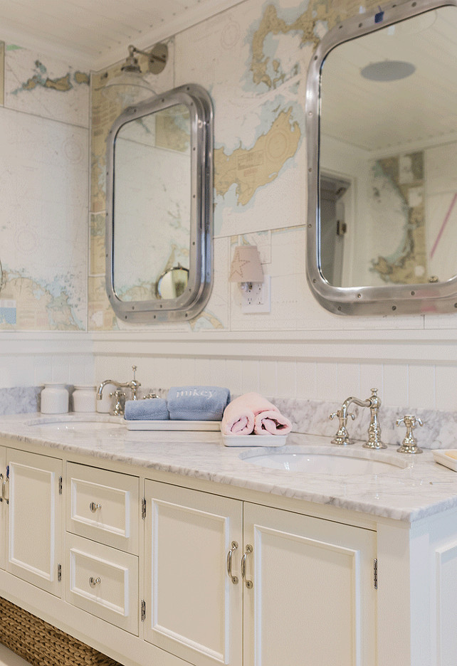 Kids Bathroom. Shared Kids Bathroom. hared kids' bathroom features vintage world map wallpaper used as a backdrop to a pair of Restoration Hardware Submarine Inset Medicine Cabinets over a white dual sink vanity topped with marble countertop fitted with his and her sinks paired with polished nickel hook and spout faucets. #SharedBathroom #KidsBathroom #Bathroom Brookes and Hill Custom Builders.