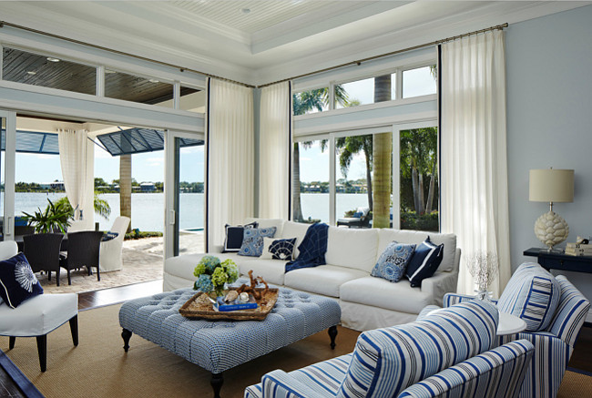 Living Room Decor. The accent pillows on the Lee Industries sofa sport solids and patterns by China Seas. River views can be enjoyed through windows and sliding glass doors from PGT Industries, accented with Duralee drapery fabric and Samuel & Sons trim. The rug is from Flor Source.LivingRoom #Decor JMA Interior Design.