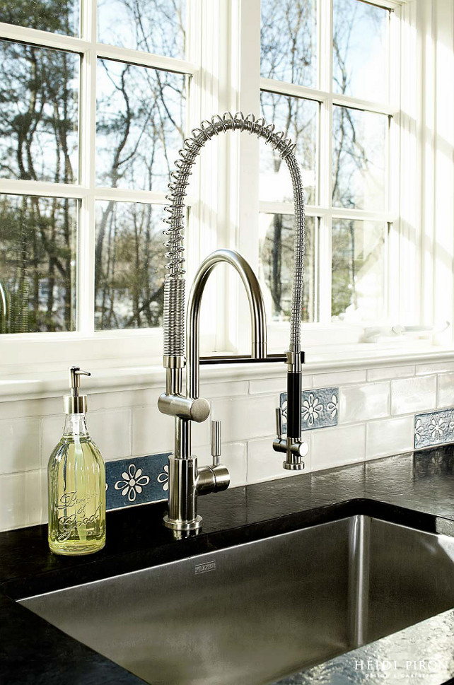 Kitchen Sink and Faucet. Close-up of perimeter sink featuring Franke (#PSX1102710) sink and faucet (#33880888-06), brown antique leather granite and custom, hand-painted tile backsplash designed by Heidi Piron Design & Cabinetry. 