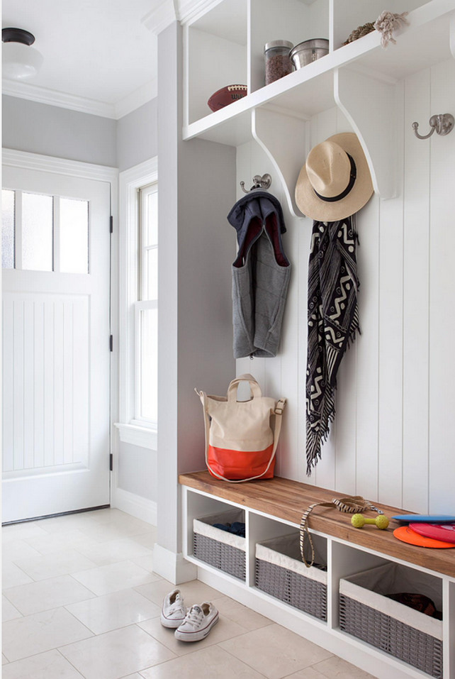 Mud room Ideas. Mud room sources. Mudroom Resources. The wall paint color in this mudroom is Stonington Gray HC-170 by Benjamin Moore. Mud room cabinet is painted in Benjamin Moore Simply White. The mudroom tile flooring is Crema Marfil Honed 12x12 floor tile. The mudroom hooks are from Restoration Hardware. #mudroom. #BenjaminMooreStoningtonGray #BMHC170