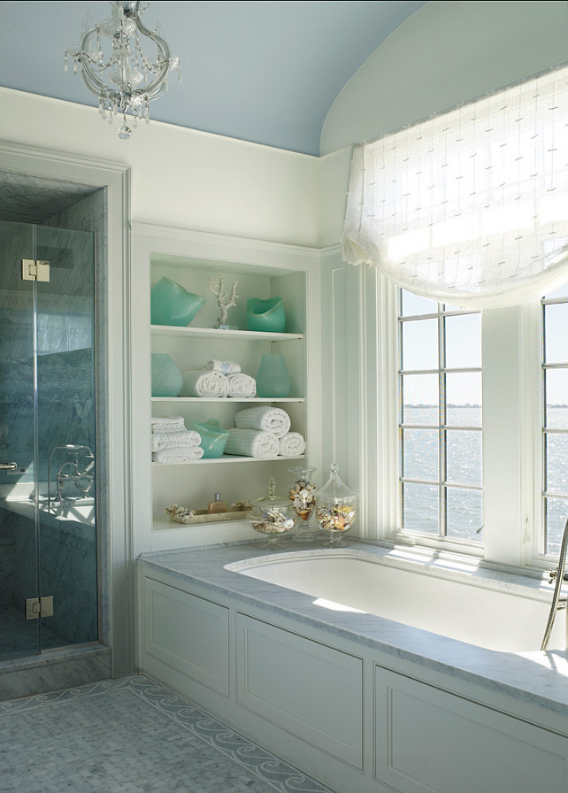 Bathroom Design. This is not a big bathroom, but the interior designer used the space wisely with nooks and with large windows. #Bathrroom