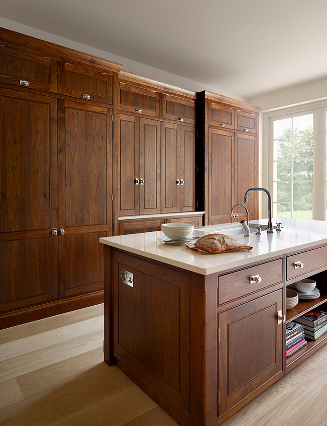 American Walnut Kitchen. American Walnut Kitchen Cabinet. The island cabinetry features the same American walnut and includes the Miele wine refrigeration and dishwasher, there are also integrated bookshelves to the rear – great for storing cookbooks. The sink and taps are by Perrin & Rowe and work perfectly with the Kohler Bakersfield sink. Humphrey Munson.