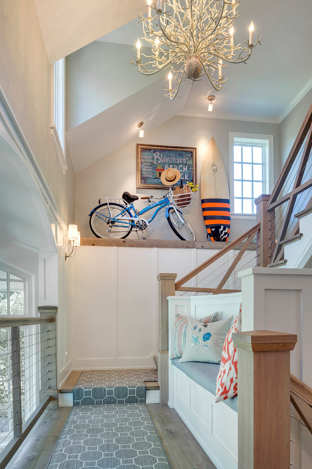 Bateen and board foyer. Foyer with Bateen and board paneled walls, gray hardwood floors and custom bench. #Foyer #BoardandBatten #BoardBatten #Paneling #WallPaneling #FoyerPaneling Great Neighborhood Homes.