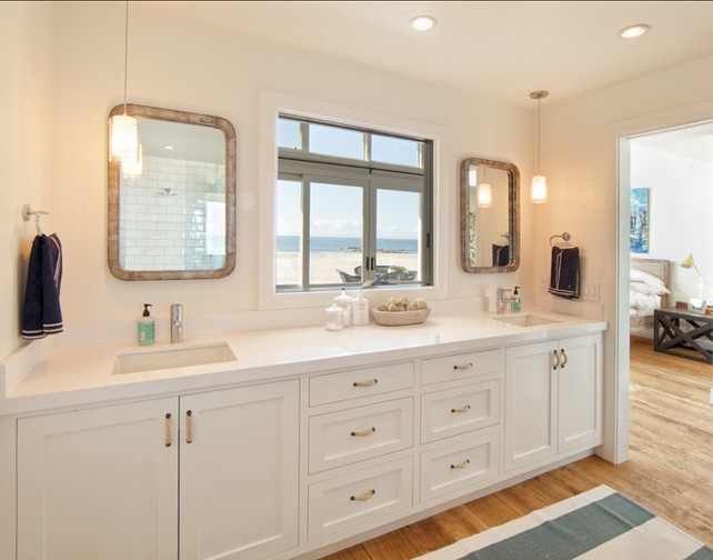 Bathroom Design Ideas. Clean designed bathroom. The mirrors in this bathroom are metal frame and purchased at Anthropologie. #Bathroom #BathroomDesign #BathroomIdeas