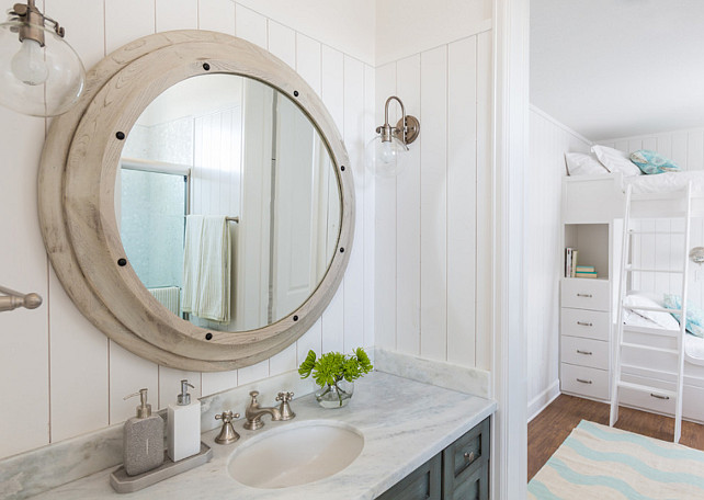 Bathroom Mirror and Sconces. The bathroom sconces are the Hinkley Lighting Congress 1 Light Sconce. Mirror is the Noir Porthole Mirror from Candelabra. #Bathroom #Mirror #Sconces Laura U, Inc.