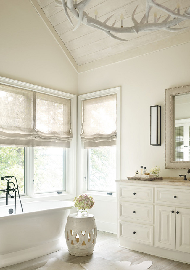 Bathroom paint color. Neutral bathroom paint color. The paint color is Benjamin Moore's China White. The treatment on the wood floors is a custom Limewash. Interior Design by Beth Webb Interiors.